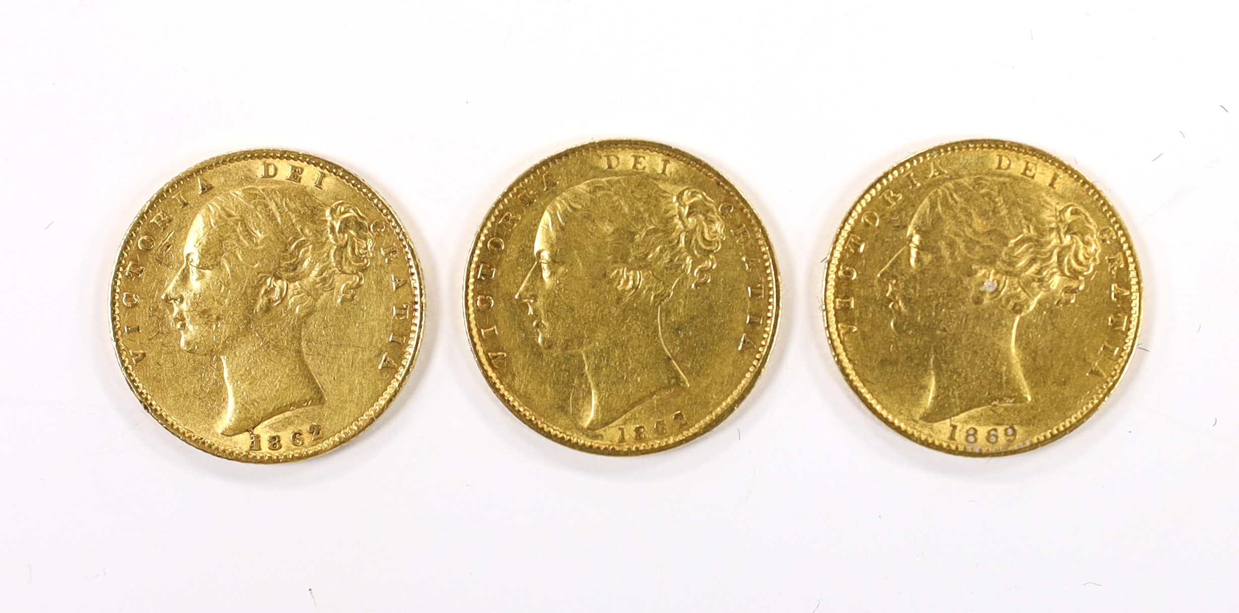 British gold coins, three Victoria gold sovereigns - 1869 die no. 28, about fine, two 1862 wide date, one with die error next to 1 (in 1862), otherwise about fine